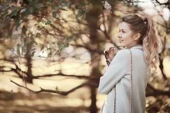walk in autumn park / beautiful girl in autumn park, model female happiness and fun in yellow trees  October