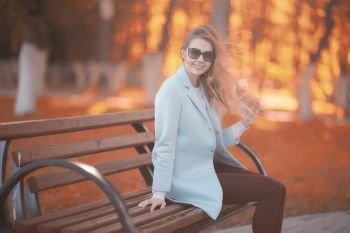 walk in autumn park / beautiful girl in autumn park, model female happiness and fun in yellow trees  October