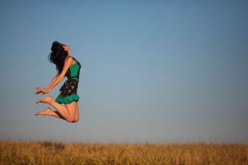 happy young girl in a field and a beautiful woman, levitation, flying from happiness