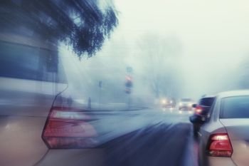 blurred background autumn fog on city road