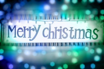 Merry Christmas greeting card, festive glowing blue and green background bokeh, door decoration, happy winter holidays