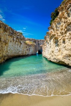 Papafragas hidden beach with crystal clear turquoise water and tunnel rock formations in Milos island, Greece. Papafragas beach in Milos island, Greece