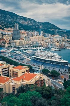 View of Monte Carlo, Monaco with race track street circuit and port with yachts and boats. View of Monaco with Formula one race track
