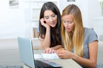 two young women doing group study