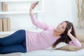 a woman is doing a selfie