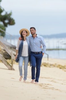 couple in love walking on the beach