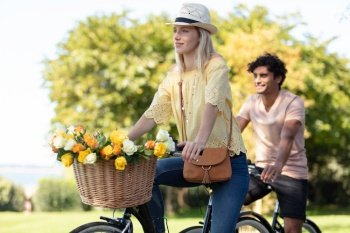 happy couple cycling in the park