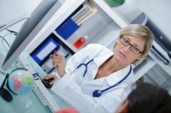 female doctor in white medical coat is consulting her patient