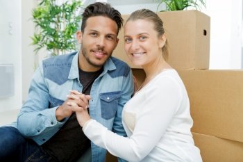 young couple moving to a new apartment together relocation