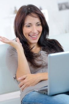 happy woman in front of her computer