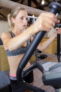 woman using a gym training equipment