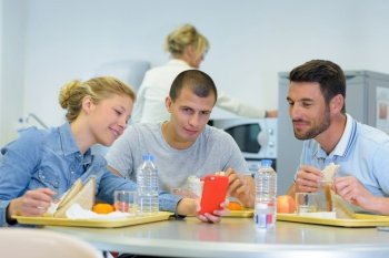 cheerful students at modern cafeteria