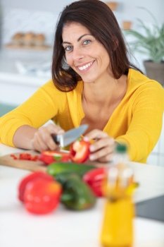 young happy woman preparing healthy meal