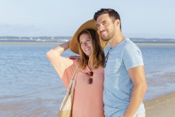 an attractive couple on the beach