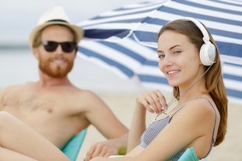 happy young couple on beach