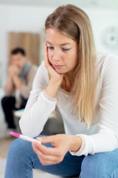 distraught girl waiting for pregnancy test result thinking about future