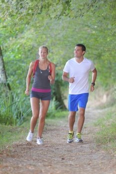 a couple running in forest