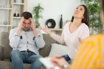 sad couple discussing on couple therapy indoors