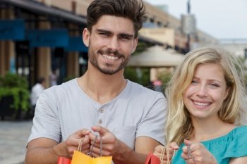 picture showing young couple shopping in the city