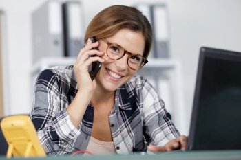 happy professional engineer woman smiling on the phone