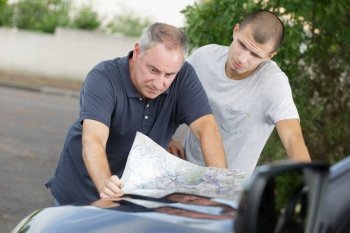 checking the map on the car