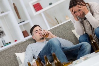 despairing mother with drunk teenage son