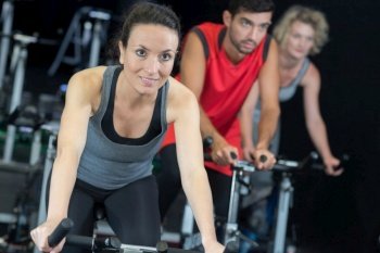 people training on the exercise bikes together