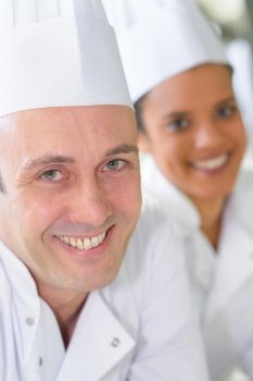head and shoulders portrait of male and female chefs
