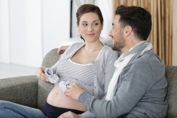 couple with baby shoe expecting the baby