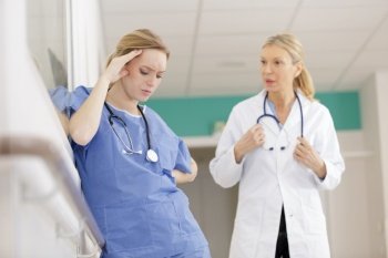a female nurse lost in thoughts