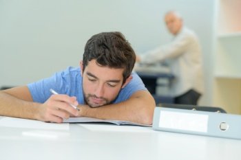 young man taking an exam