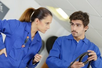 young female and man working togther