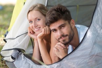 couple enjoying the morning in a tent