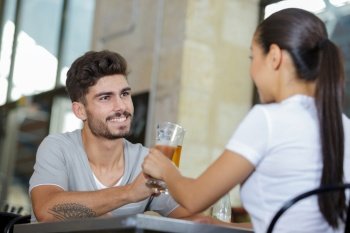 couple having beers at outdoor party