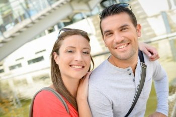 Couple posing for photograph outdoors