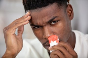 young black man suffering from sinusitis