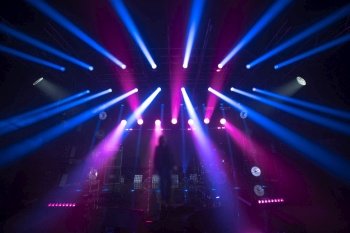 rays of light illuminate the scene at the concert.