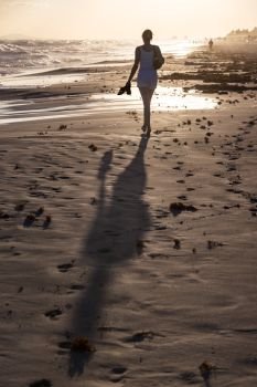 girl on a sand beach sunset