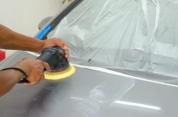 Man working for polishing, coating cars.