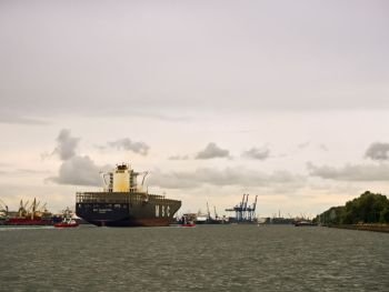 24 June 2018, Baltic sea, Klaipeda, Lithuania, port, canal, empty container ship, cargo ship with escort. cargo ship with escort, empty container ship