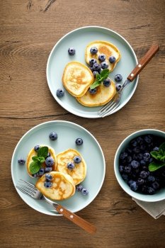 Banana pancakes with fresh blueberry, top view