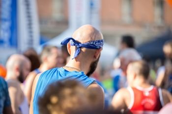 Bald Marathon Runner with a Bandana on his Head Ready to Take Part in the Race.. Bald Marathon Runner with a Bandana on his Head Ready to Take Part in the Race