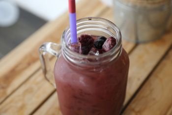 mix berry juice on wood background