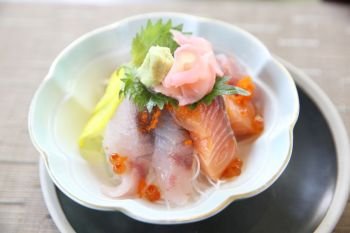 Sushi don , raw sushi salmon tuna octopus and egg on rice , Japanese food