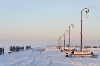 Embankment of Northern Dvina in Arkhangelsk, Russia. Covered with snow. Winter time.