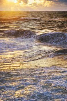 Sea waves on sunset. Nature composition.