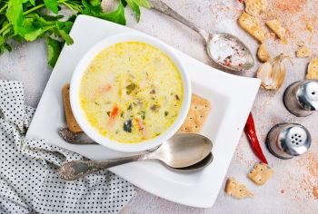 cheese soup with mushrooms and fresh greens
