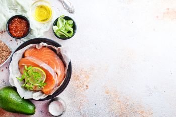 red salmon fillet in bowl on a table
