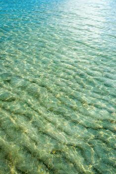 Water ocean background. Clear green blue ripple aqua texture. Blue sea surface with waves