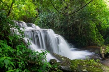 Man Daeng waterfall, Waterfall with autumn color change Beautiful nature.. Man Daeng waterfall.